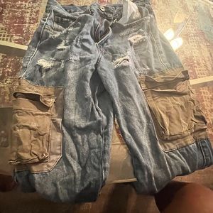 Denim cargo pants with green pockets